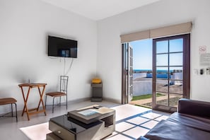 Apartment, 1 Queen Bed with Sofa bed, Partial Ocean View (Jr Suite 3 - Playa Arcangel) | Living area - Dog-friendly Beach Haven With Heated Pool, Hot Tub, Kitchenette, Patio, AC (Playas de Rosarito)