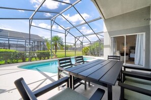 Outdoor dining - Cumbrian Dream: 4BR Pool Home Near Disney & Orlando Attractions (Kissimmee)