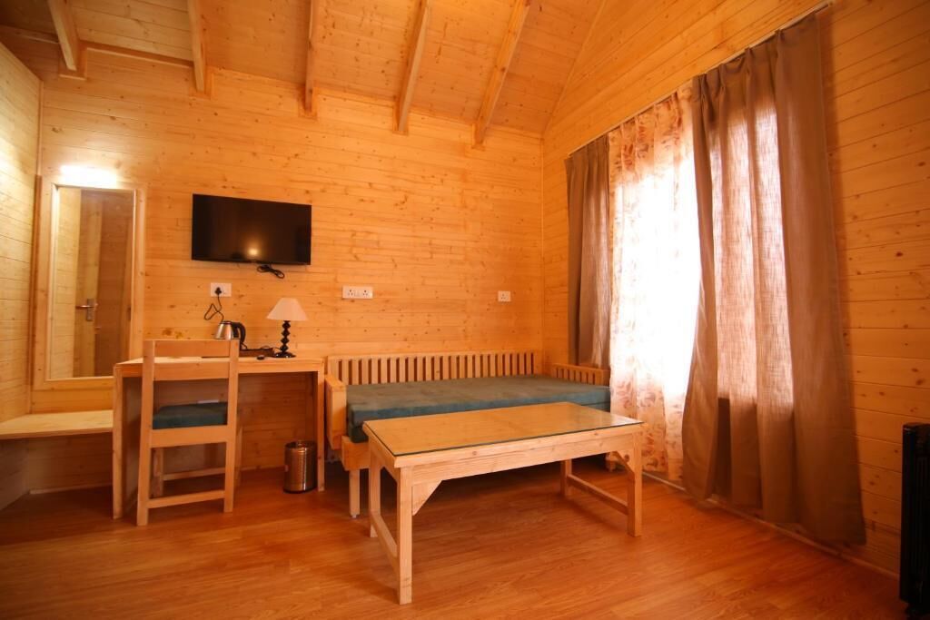Habitación cuádruple Deluxe, vistas a la montaña | Interior
