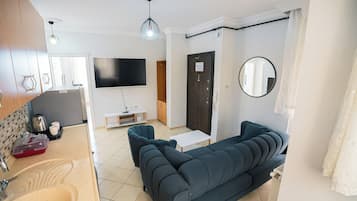 Deluxe Apartment, Balcony | Living area