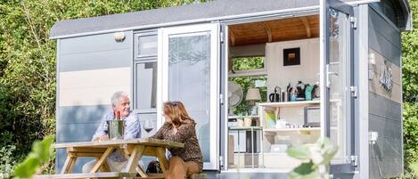 A mobile home with a dining area and a kitchen.