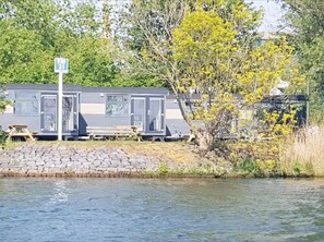 House | View from property - Romantic Lakeside Wagon Retreat (Almere)