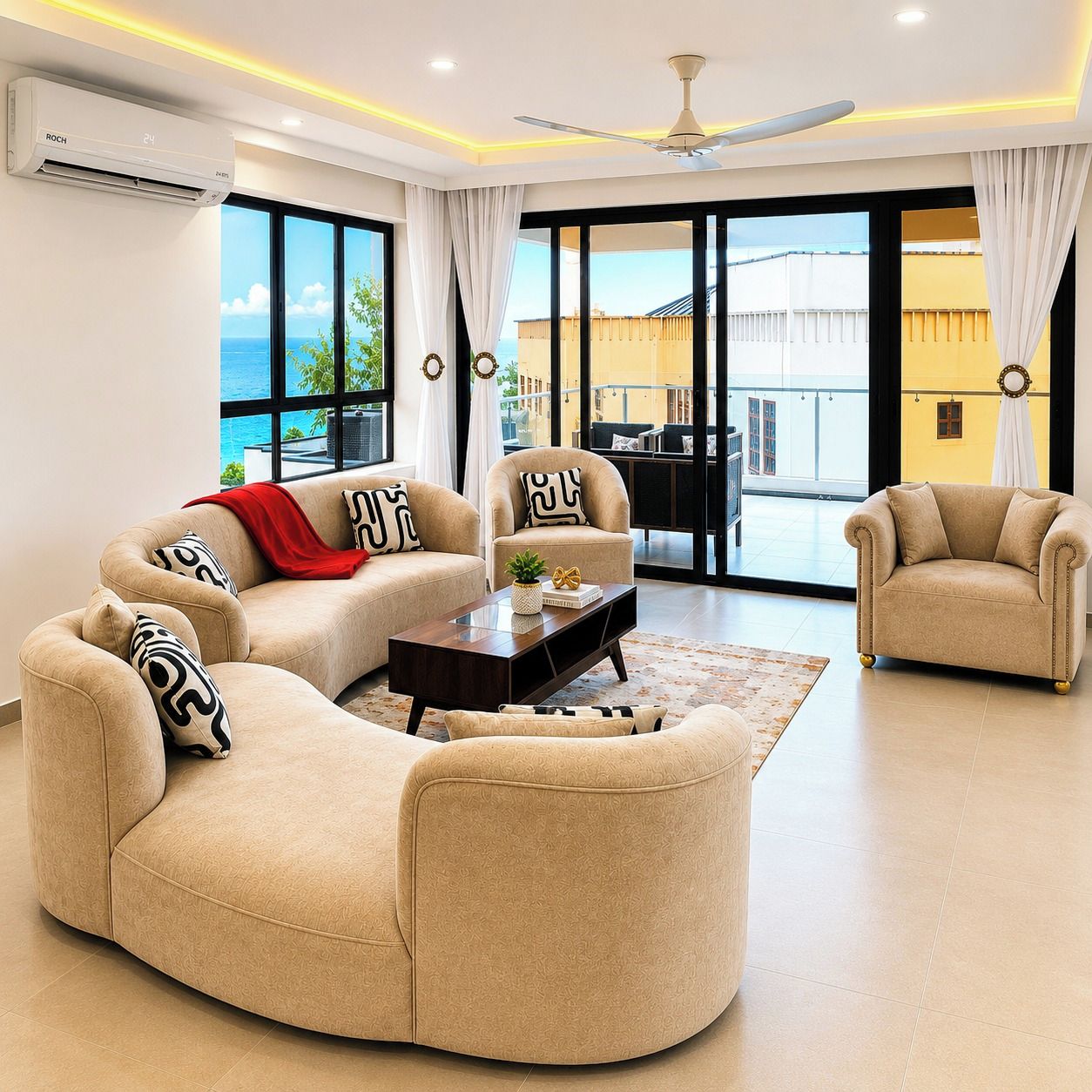 Un salon moderne comprenant un ensemble de canapés, une table basse et un ventilateur de plafond.
