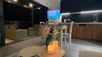 Luxury Apartment, Sea View | Living area | Flat-screen TV