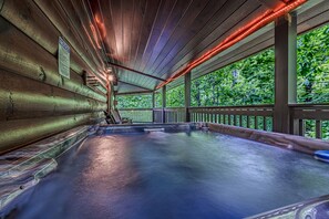 A hot tub area with wooden walls and a view of trees. - Dreamy Secluded Cabin Near Dollywood and GSMNP (Sevierville)