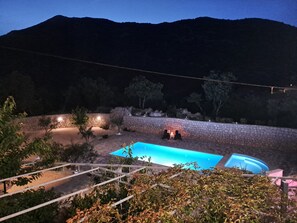 A swimming pool with stone walls, surrounded by vegetation and a mountain in the background. - ★★★★ Villa Bella Vita - Big Private Pool - Tranquility ★★★★ (Duge Njive)