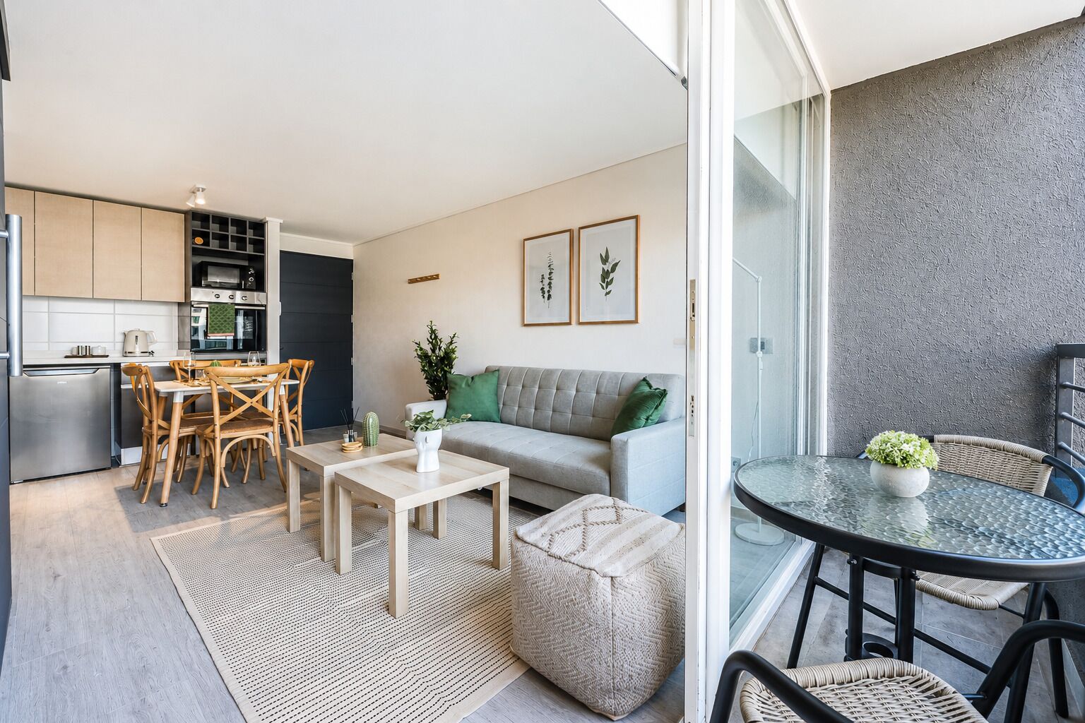 A modern apartment with a kitchen, dining area, and living room.