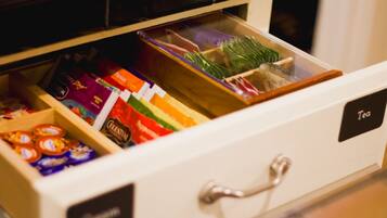 A drawer with compartments containing various packaged items.