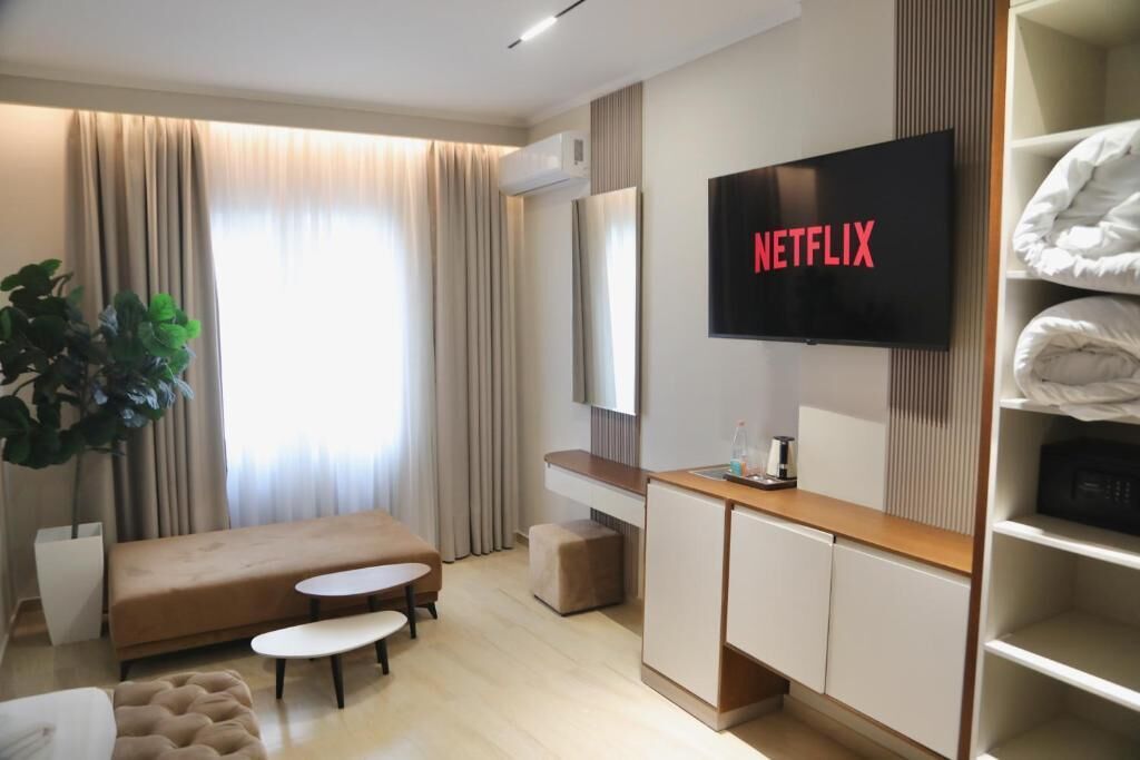 Deluxe Room, Balcony | Living area