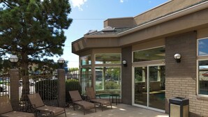 An outdoor patio area with lounge chairs and a pool. - 3 Modern Units | Explore Downtown Attractions | Free Breakfast, Parking, & Pool (Salt Lake County)