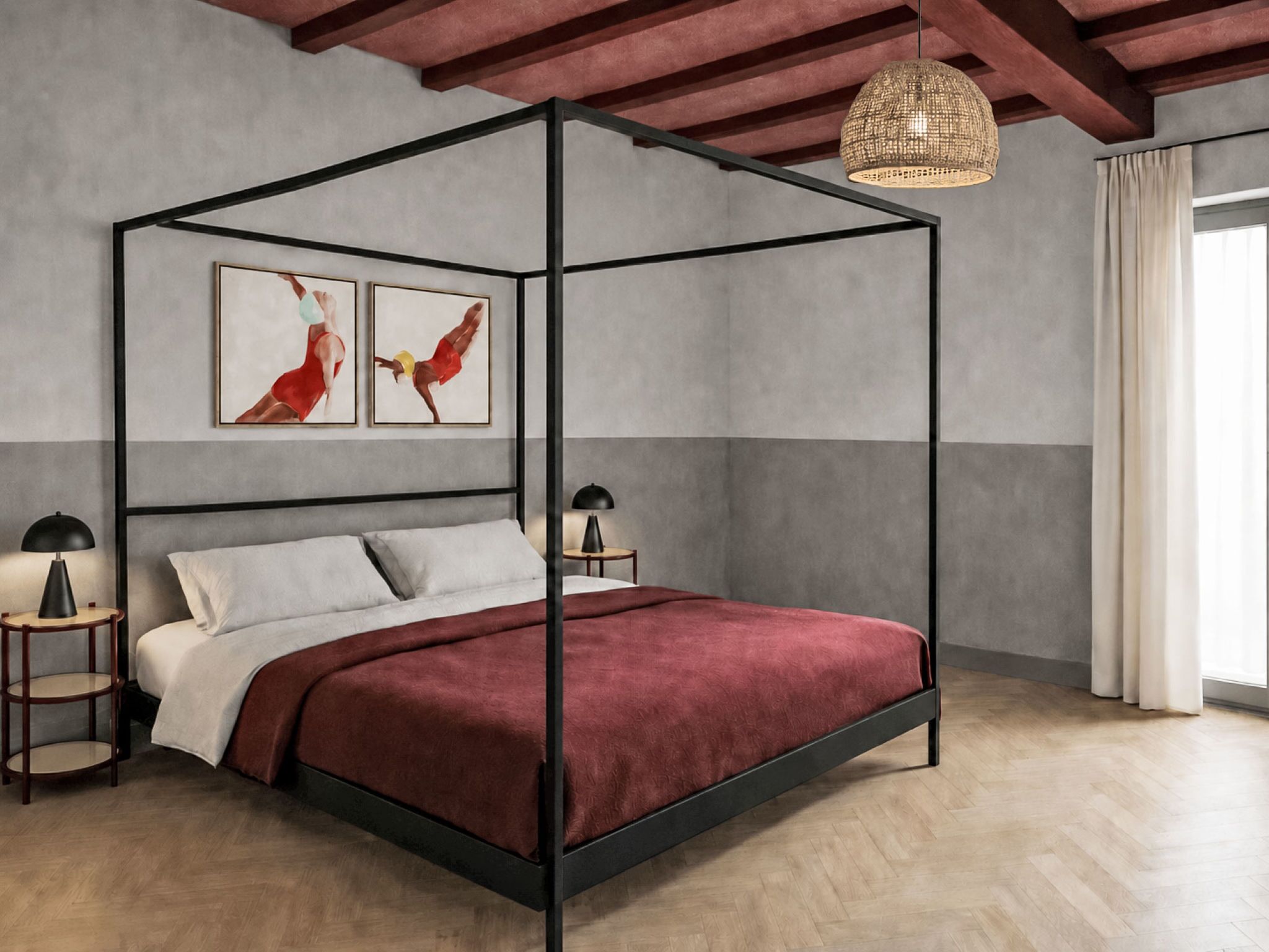 A four-poster bed with a red bedspread, two wall-mounted paintings, and a hanging light fixture.