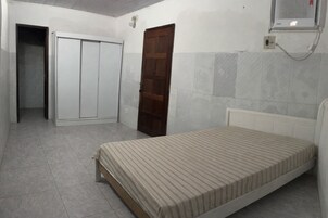 Suíte, 1 cama Queen | Wi-Fi de cortesia, roupa de cama