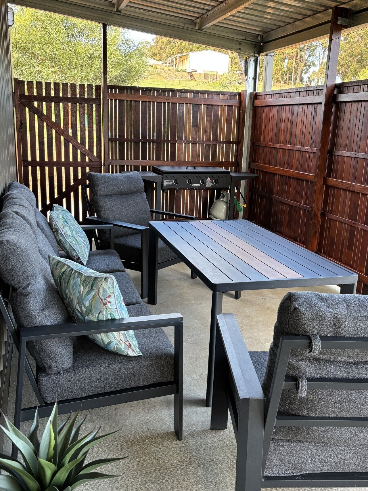 BBQ, table and chairs perfect for relaxed outdoor meals
