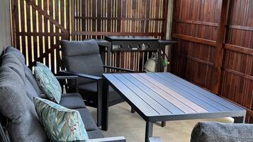 BBQ, table and chairs perfect for relaxed outdoor meals