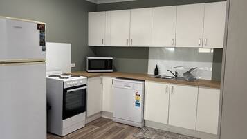 Full size fridge, oven, dishwasher and microwave
