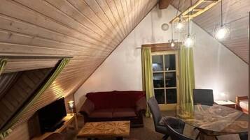 Studio, Balcony, Hill View | Living area | 30-inch TV with cable channels