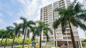 A multi-story residential building with a playground in the foreground. - Scenic Valley Serviced Apartment (Ho Chi Minh City)