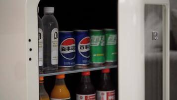 A beverage vending machine with various drink options.