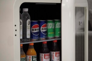 A beverage vending machine with various drink options.
