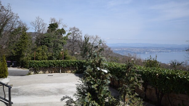 A parking area with a view of a city and a body of water. - Nice Apartment With Terrace and Outdoor Kitchen and sea View ! (Opatija)