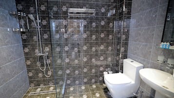 Shower, hair dryer, slippers, towels