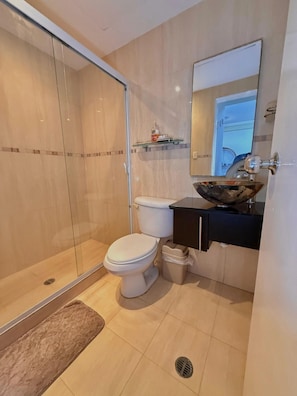 Shower, towels, soap, toilet paper