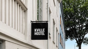 A hostel named 'KVILLE HOSTEL' with a white exterior and a visible window. - Kville Hostel (Gothenburg)