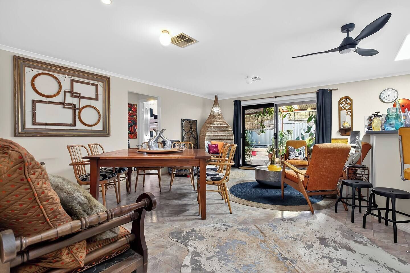 Unique pieces and eclectic décor run through the open living, dining, and lounge spaces, which flow effortlessly together to create plenty of room for gatherings.