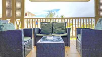 Chic casual ocean themed condo located  in Tobago 's most exclusive compound .