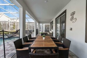 Outdoor dining - 8BR Villa with Pool, Spa, Theater & Game Room (champions gate)