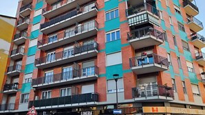 A multi-story building with balconies, a ground-floor entrance, and a visible sign for 'LUMERIA'. - CASA GB - Your home in the center of Turin (Torino)
