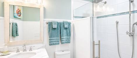 Shower, hair dryer, towels, soap