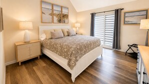 A bedroom with a bed, two bedside tables, a dresser, a window with blinds, and a ceiling fan. - Upscale Rehoboth Retreat Minutes from Beach & Boardwalk (Rehoboth Beach)