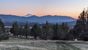 A mountainous landscape with a prominent peak, dense forest, and open fields. - Cascade Valley Wonderland campground in Hornbrook perfect for outdoor adventures (HORNBROOK)