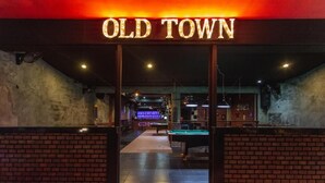The entrance to a venue named 'Old Town' with a pool table visible inside. - Old Town (Pattaya)