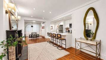 A modern interior with a kitchen, dining area, and a bar.
