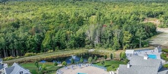 Tranquil cottage with AC, heated pools and game room, close to local beaches.