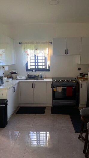 Private kitchen -     Beautiful 2BR Retreat in Gated Community – St. Ann, Jamaica. (Runaway Bay)
