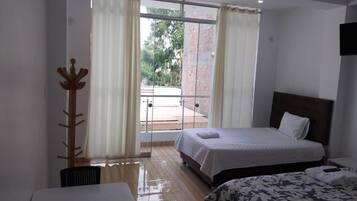 Family Room, Balcony, Garden View | Free WiFi
