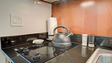 Mini-fridge, microwave, stovetop, coffee/tea maker