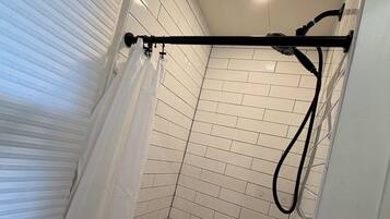 Shower, towels, soap, toilet paper