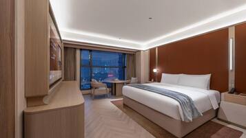 Executive Suite, City View | Laptop workspace, blackout curtains, iron/ironing board, free WiFi