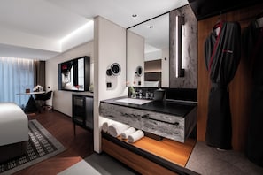 A modern hotel bathroom with a large mirror, a sink, and a towel rack. - IntercityHotel Taikoo Li Chunxi Rd (Chengdu)