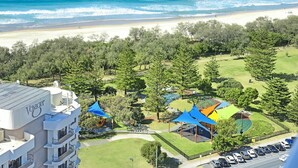 A hotel with a pool, a beach view, and a parking area. - Ocean Perfection at Oracle Level 23 (Gold Coast City)