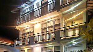 A multi-story hotel with a swimming pool, outdoor seating, and balconies. - The Kumatha Residence,Second Floor Studio apartment, 5 minutes walk to the beach (Negombo)