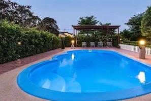 A swimming pool with a pergola and seating area. - Crystal orange chengdu KuanZhai Alley (Chengdu)
