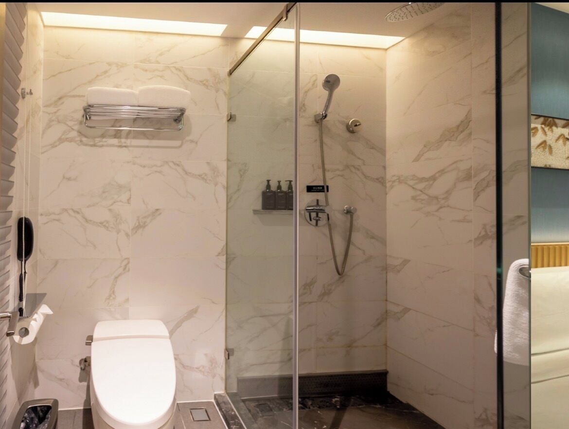 Shower, rainfall showerhead, designer toiletries, hair dryer