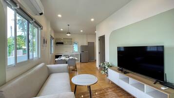 One Bedroom Private Garden | Living area | 32-inch flat-screen TV with satellite channels
