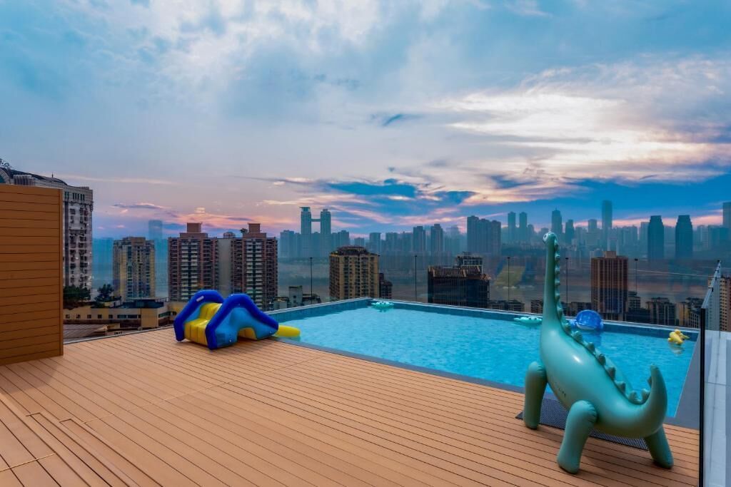 Seasonal outdoor pool, open 5:00 PM to 10:30 PM, pool umbrellas
