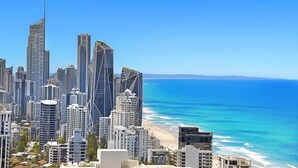 A coastal cityscape with high-rise buildings, a beach, and clear blue skies. - Ocean Skyhome at Oracle Level 40 (Gold Coast City)